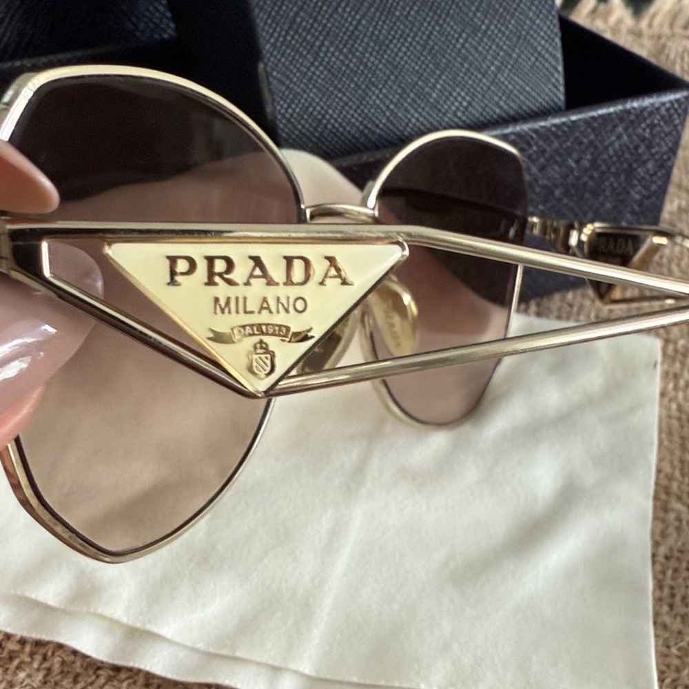 Prada Women's Sunglasses with Gold Frame